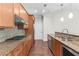 Well-equipped kitchen featuring granite counters, stainless steel appliances, and wooden cabinets at 270 17Th Nw St # 4306, Atlanta, GA 30363