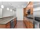 Stylish kitchen featuring granite countertops, stainless steel appliances, and wood floors at 270 17Th Nw St # 4306, Atlanta, GA 30363