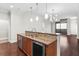 Open kitchen design featuring granite counters, stainless appliances, and pendant lighting at 270 17Th Nw St # 4306, Atlanta, GA 30363