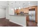 Modern kitchen features stainless steel appliances and a granite-topped breakfast bar at 270 17Th Nw St # 4306, Atlanta, GA 30363