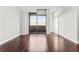 Spacious living area with balcony access, and hardwood floors, perfect for entertaining or relaxation at 270 17Th Nw St # 4306, Atlanta, GA 30363