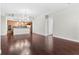 Open-concept living space with hardwood floors and modern fixtures to the kitchen with updated appliances at 270 17Th Nw St # 4306, Atlanta, GA 30363