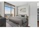 Serene main bedroom with city views, a modern design, and a spacious walk-in closet at 270 17Th Nw St # 4306, Atlanta, GA 30363