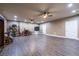 Spacious finished basement with hardwood floors, recessed lighting, and dual ceiling fans at 3300 Pierce St, College Park, GA 30337