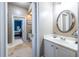 Bathroom view showcasing a vanity, with a bedroom visible through an open door at 3300 Pierce St, College Park, GA 30337