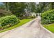Long driveway leading to a home with a lush, green lawn and mature landscaping at 3300 Pierce St, College Park, GA 30337
