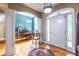 Bright foyer featuring an open floor plan with hardwood floors, a dining area, and large windows at 3300 Pierce St, College Park, GA 30337