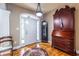 Foyer with hardwood floors, a grandfather clock and bureau at 3300 Pierce St, College Park, GA 30337