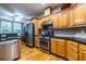 Functional kitchen with stainless steel appliances, granite counters, and wood cabinets at 3300 Pierce St, College Park, GA 30337