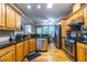 Spacious kitchen featuring stainless steel appliances, granite counters, and wood cabinetry at 3300 Pierce St, College Park, GA 30337