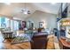 Spacious living room with hardwood floors, comfortable seating, and a stone fireplace at 3300 Pierce St, College Park, GA 30337