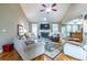 Inviting living room featuring a stone fireplace, high ceilings, and hardwood floors at 3300 Pierce St, College Park, GA 30337