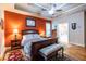 Cozy main bedroom with tray ceilings, hardwood floors, and ensuite bathroom at 3300 Pierce St, College Park, GA 30337