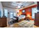 Cozy main bedroom with tray ceilings, hardwood floors, and double doors leading to the backyard at 3300 Pierce St, College Park, GA 30337