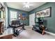 Cozy office space featuring a large desk, dark green walls, and natural light at 3300 Pierce St, College Park, GA 30337