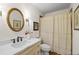 Charming bathroom with a single sink vanity, a gold framed mirror, and a shower with a curtain at 4340 Hadaway Nw Rd, Kennesaw, GA 30152