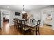 Formal dining room featuring a large table, wood floors and elegant lighting at 4340 Hadaway Nw Rd, Kennesaw, GA 30152