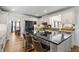 Modern kitchen with black island, stainless steel appliances, and white cabinetry, perfect for cooking and entertaining at 4340 Hadaway Nw Rd, Kennesaw, GA 30152