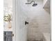 Elegant marble shower with rainfall shower head and a built-in bench provides a spa-like experience at 4340 Hadaway Nw Rd, Kennesaw, GA 30152