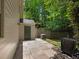 Fenced-in backyard with a wooden shed, patio, and shaded grassy area at 1355 E Rock Springs Ne Rd, Atlanta, GA 30306