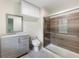Modern bathroom featuring a gray vanity with granite counters, marble floors, and a glass shower at 1355 E Rock Springs Ne Rd, Atlanta, GA 30306
