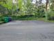 Large driveway with green landscape and recycling cans at 1355 E Rock Springs Ne Rd, Atlanta, GA 30306