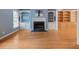 Bright living room with hardwood floors, a fireplace, and custom built-in shelving at 1355 E Rock Springs Ne Rd, Atlanta, GA 30306