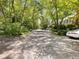 Street view lined with mature trees and neighboring homes at 1355 E Rock Springs Ne Rd, Atlanta, GA 30306