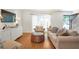 Bright and airy living room boasts hardwood floors, large windows, and plush seating at 136 Peachtree Memorial Nw Dr # 8-2, Atlanta, GA 30309