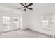 Bright bedroom featuring neutral carpet, ceiling fan and two windows for abundant natural light at 1995 Bryant Park Ln, Decatur, GA 30033
