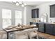 Beautiful dining area boasts a modern light fixture, ample windows, and a stylish wine cooler at 1995 Bryant Park Ln, Decatur, GA 30033