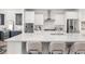 Modern kitchen featuring a large island with seating, stainless steel appliances, and white cabinets at 1995 Bryant Park Ln, Decatur, GA 30033