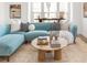 Close up of living room showing a stylish sectional sofa, jute rug and decor at 1995 Bryant Park Ln, Decatur, GA 30033