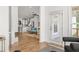 Hardwood floors extend into open-concept living room, kitchen, and balcony with plentiful natural light at 1995 Bryant Park Ln, Decatur, GA 30033