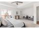 Large main bedroom features balcony access with seating, neutral colors, and hardwood flooring at 1995 Bryant Park Ln, Decatur, GA 30033