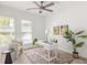 Bright office with fan, desk, chair, and decorative artwork and potted plant at 1995 Bryant Park Ln, Decatur, GA 30033