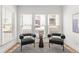 Bright sitting area featuring modern chairs, a small side table and light filtering window shades at 1995 Bryant Park Ln, Decatur, GA 30033