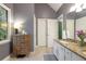 Bathroom featuring granite countertop vanity with drawers and a large window at 2206 Heritage Trace Dr, Marietta, GA 30062