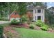Charming home with a well-maintained front yard and garden landscaping at 2206 Heritage Trace Dr, Marietta, GA 30062