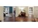 Hallway with hardwood floors that connect the living room to the kitchen at 2206 Heritage Trace Dr, Marietta, GA 30062