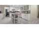 Bright kitchen with white cabinetry, butcher block counters, mosaic backsplash and a movable center island at 2206 Heritage Trace Dr, Marietta, GA 30062