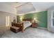 Spacious main bedroom with green accent wall and natural light at 2206 Heritage Trace Dr, Marietta, GA 30062