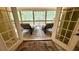 Screened in back porch with tile flooring and outdoor seating at 2206 Heritage Trace Dr, Marietta, GA 30062