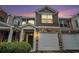Charming townhome featuring stone accents, a covered entrance, and an attached one car garage at 2731 Pierce Brennen Ct, Lawrenceville, GA 30043