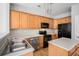 Efficient kitchen showcasing wooden cabinets, modern stainless steel appliances, and sleek countertops at 2731 Pierce Brennen Ct, Lawrenceville, GA 30043
