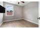 Empty bedroom featuring hardwood flooring, a large window and a TV at 671 Brennan Dr, Decatur, GA 30033