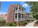 Classic brick townhome with beautiful large porches and a manicured landscape at 671 Brennan Dr, Decatur, GA 30033