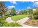 A lovely exterior view of a community green space with beautiful landscaping at 671 Brennan Dr, Decatur, GA 30033