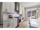 Well-equipped kitchen with stainless steel appliances, tile backsplash, and ample cabinet space at 671 Brennan Dr, Decatur, GA 30033