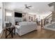 Bright living room featuring neutral colors, a ceiling fan, hardwood floors and a fireplace at 671 Brennan Dr, Decatur, GA 30033